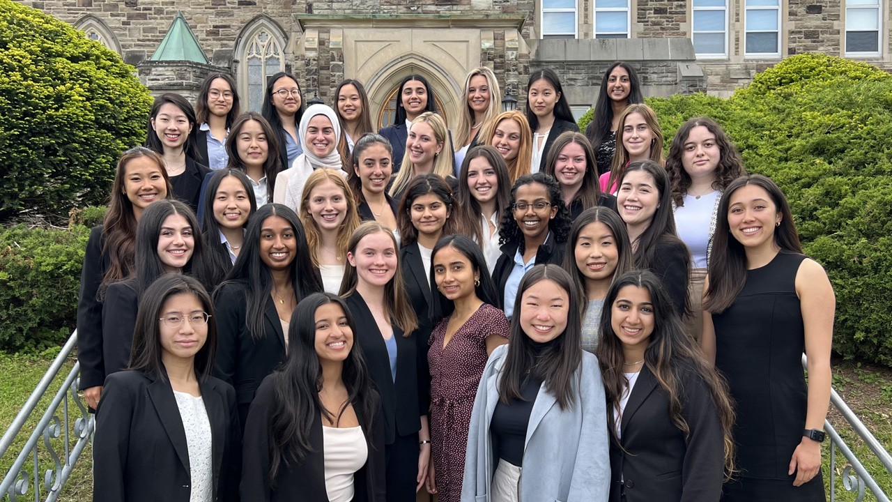 girls-standing-in-front-of-university